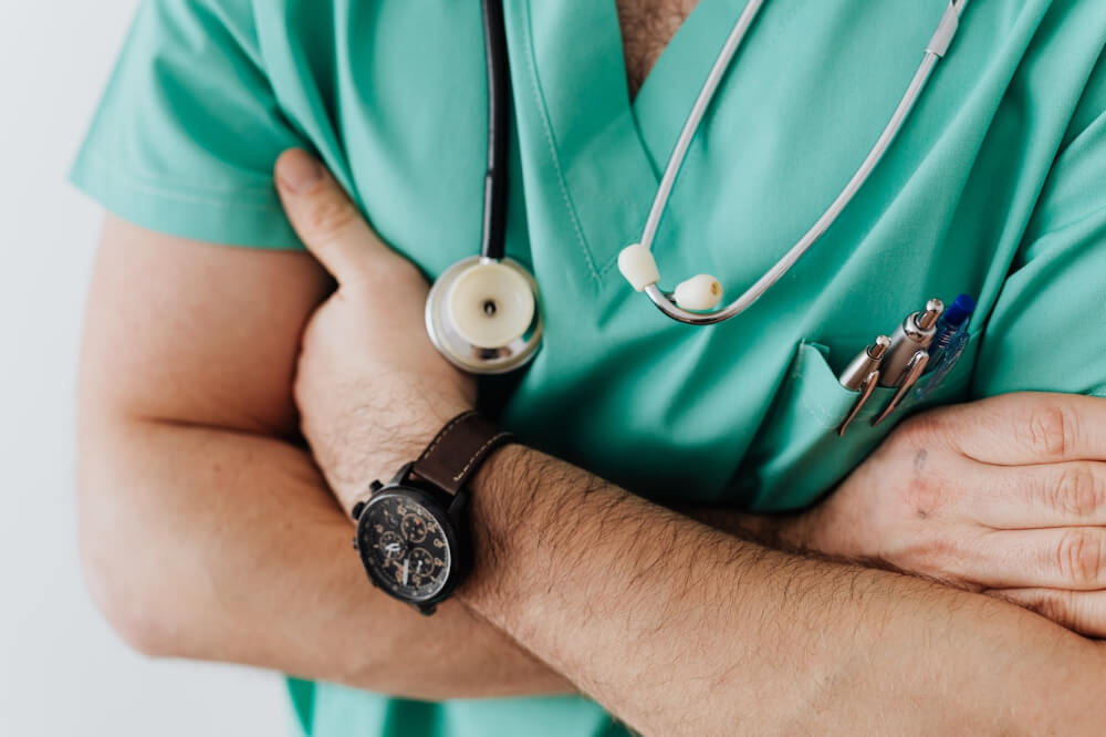 Doctor with stethoscope in hospital Stock Photo