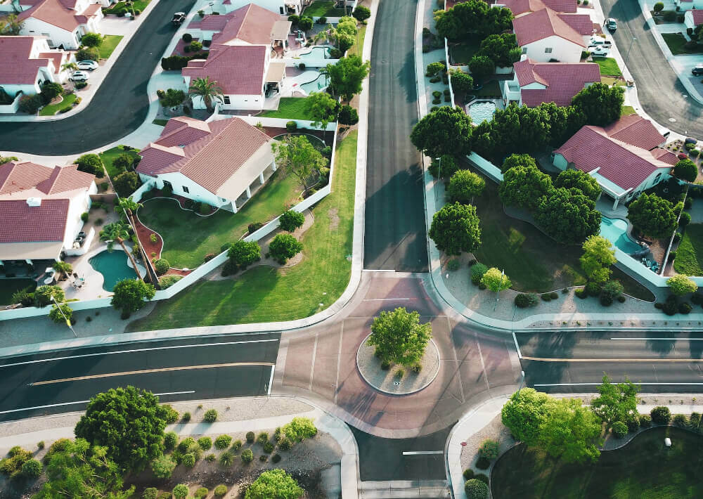 Arial view of city with white-and-red houses during day time