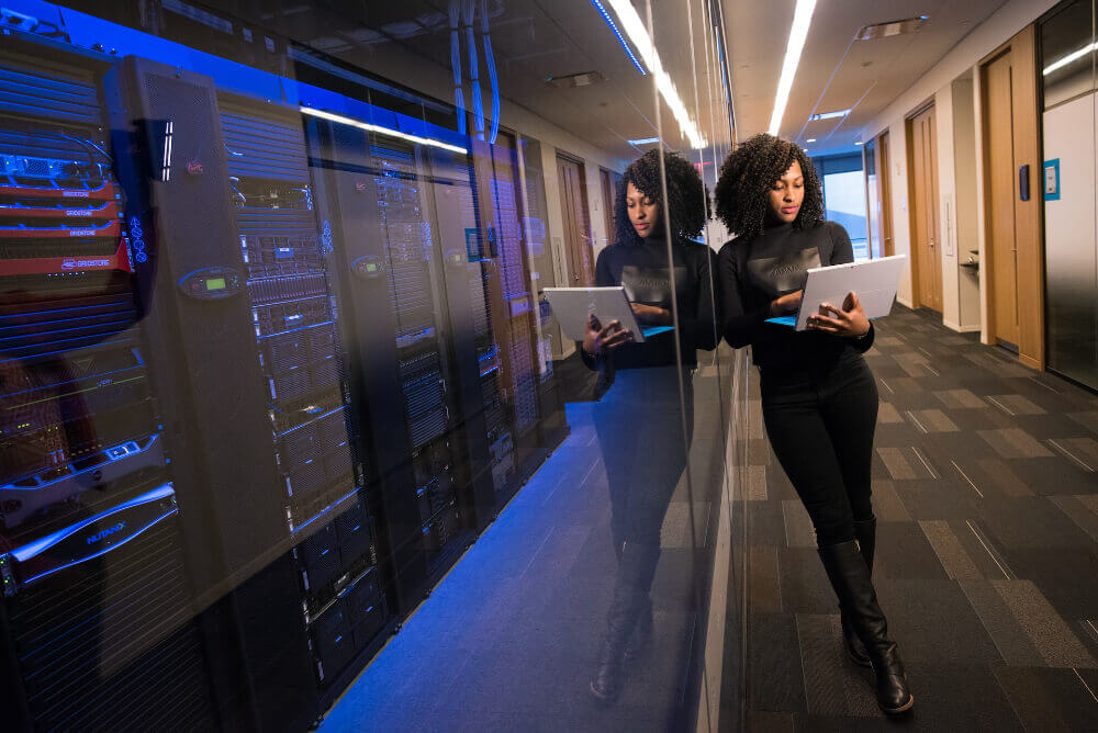 Woman in black top using Surface laptop