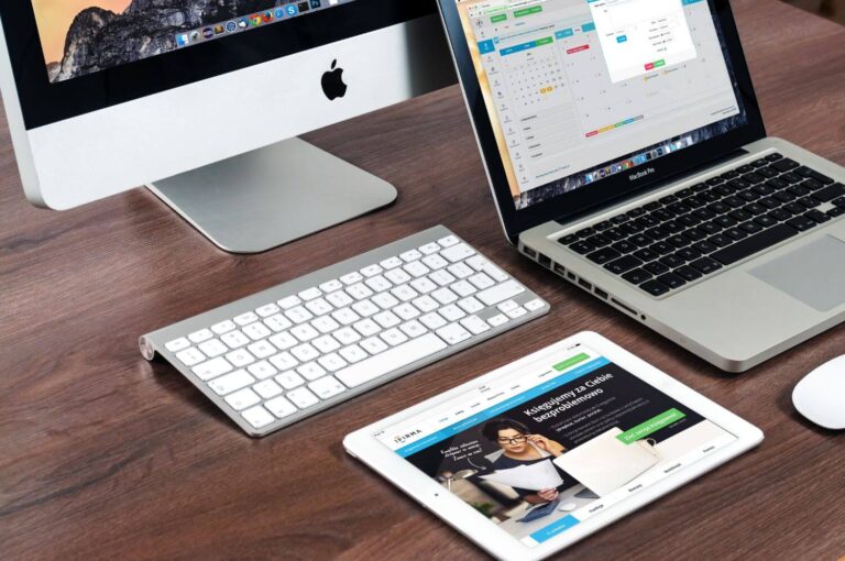 Apple iMac & MacBook Pro on brown desk