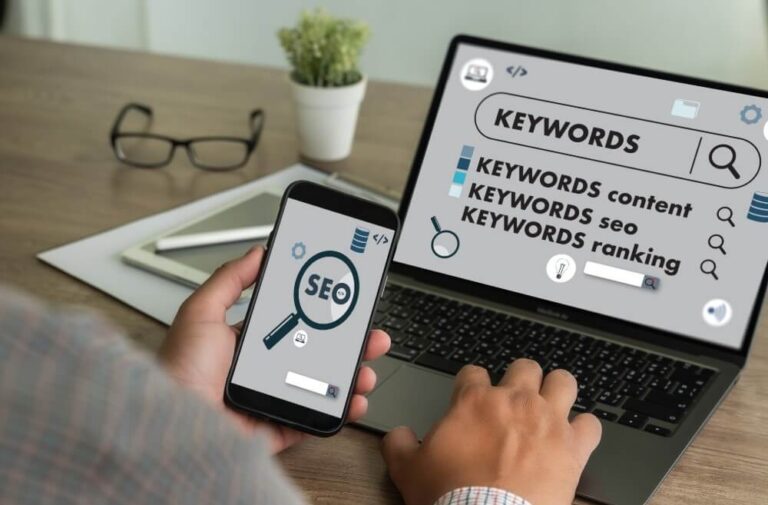 A digital marketer analyzing mobile SEO metrics on a smartphone and laptop, emphasizing the importance of mobile optimization for search rankings.